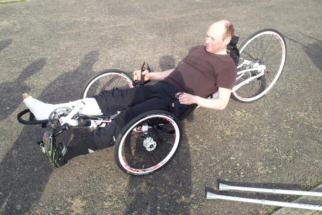 Steve Abraham back on the road pedalling a recumbent with one leg